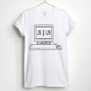 May include: White t-shirt with a black and white illustration of a computer with the text "2B || !2B" on the screen.