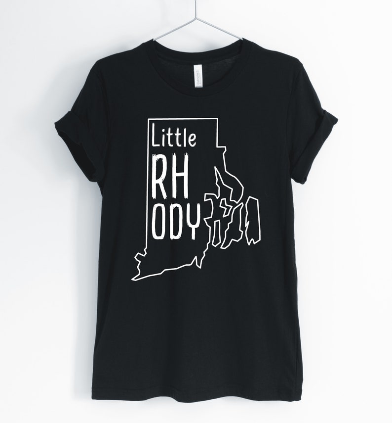 May include: Black t-shirt with a white outline of the state of Rhode Island and the text "Little Rhody" inside the outline.