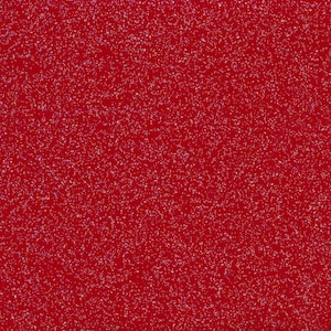 Puede incluir: Primer plano de un fondo de purpurina roja. La purpurina es muy fina y crea un efecto brillante.