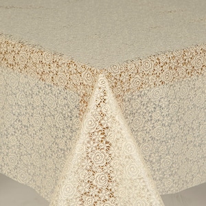 May include: A white lace tablecloth with a delicate floral pattern. The tablecloth is made of a lightweight material and has a soft, flowing texture.