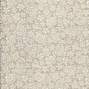 May include: Ivory lace fabric with a floral pattern featuring roses and small flowers. The delicate design is set against a neutral background, creating a textured, detailed appearance. This fabric is suitable for various craft and sewing projects.