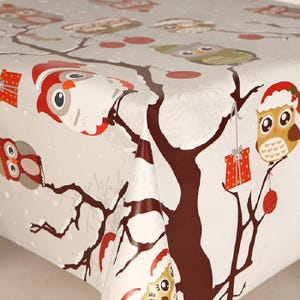May include: A Christmas-themed tablecloth with a repeating pattern of owls in Santa hats and ornaments. The owls are on brown tree branches against a light grey background with white polka dots. Red and green accents enhance the festive design.