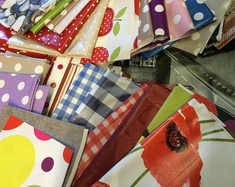 2kg PVC Table Cloth Off Cuts, Remnants, End of Roll Pieces Assorted Sizes Colours Shapes in a bundle