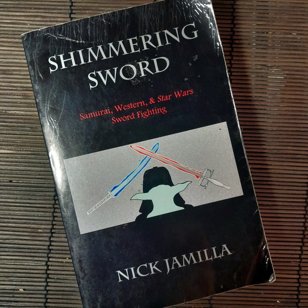 Used Pre-owned  Shimmering Sword  Samurai Western & Star Wars Sword Fighting softcover paperback book Nick Jamilla 2002 Fair Condition