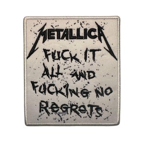 May include: Square patch with the band name "Metallica" in black, stylized lettering. Below, the patch features the text "FUCK IT ALL AND FUCKING NO REGRETS" in a distressed font, on a white background with black speckles.