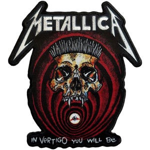 May include: Embroidered patch featuring the band name "METALLICA" in white, above a skull design with a red and black spiral background. The text "IN VERTIGO YOU WILL BE" is at the bottom. The patch has a black border.