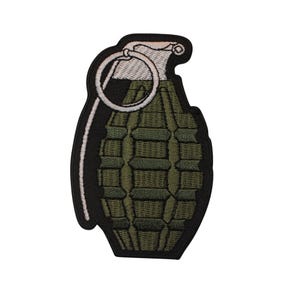 May include: Embroidered patch featuring a green grenade design with a white pull ring and accents. The patch has a black border and is set against a white background.