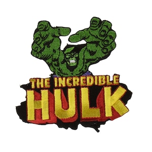 May include: Embroidered patch featuring the Incredible Hulk. The design shows the Hulk's green hands and face, with the text "THE INCREDIBLE HULK" in yellow and red. The patch has a black border and is likely for clothing or accessories.