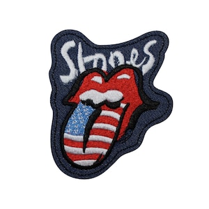 May include: A set of three ceramic mugs with a speckled, matte finish. The mugs are in shades of cream, light gray, and dark gray. Each mug has a simple, minimalist design and a rounded handle.