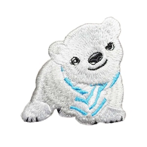 May include: Embroidered patch of a smiling polar bear cub in white with a blue scarf. The patch features detailed stitching, including black eyes and nose, and is designed to be ironed or sewn onto fabric.