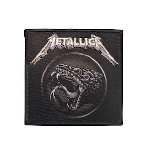 May include: Black square patch featuring the band name "METALLICA" in silver, above a detailed grayscale image of a snake's head with its mouth open. The patch has a black border.