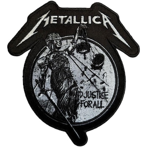 May include: Black and white embroidered patch featuring the Metallica logo and the phrase "...AND JUSTICE FOR ALL." The patch depicts the Statue of Justice holding scales, set within a circular design. The patch has a unique shape with wing-like extensions.