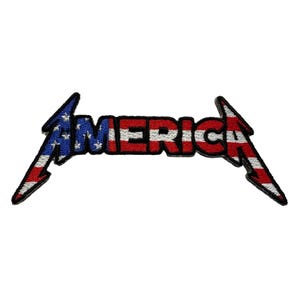 May include: Embroidered patch featuring the word "AMERICA" in a stylized font. The letters are in red and white stripes, with the "A" and the lightning bolt-shaped ends in blue with white stars and red stripes, resembling the American flag.