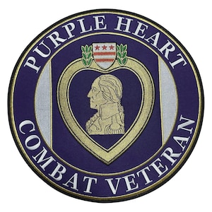 May include: Circular patch with the words "PURPLE HEART COMBAT VETERAN" in white lettering. The patch features a gold heart with a profile of a person inside. Above the heart is a crest with three stars and a red and white striped design.