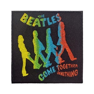 May include: Embroidered patch featuring the Beatles walking in silhouette. The text "THE BEATLES" is in a rainbow gradient above the figures, with "COME TOGETHER SOMETHING" below. The patch is square and black.