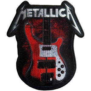 May include: Embroidered patch featuring a red and silver bass guitar design with the band name "METALLICA" in white block letters. The patch has a black border and a distressed red background.
