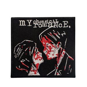May include: A square black embroidered patch featuring the text "MY CHEMICAL ROMANCE" in white at the top. Below the text, an embroidered illustration depicts two figures facing each other, detailed with white outlines and red blood-like accents.