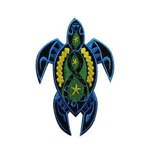 May include: Embroidered patch in the shape of a sea turtle. The turtle features a blue outline with black accents, a green center, and yellow and white star details. The design is symmetrical and detailed.