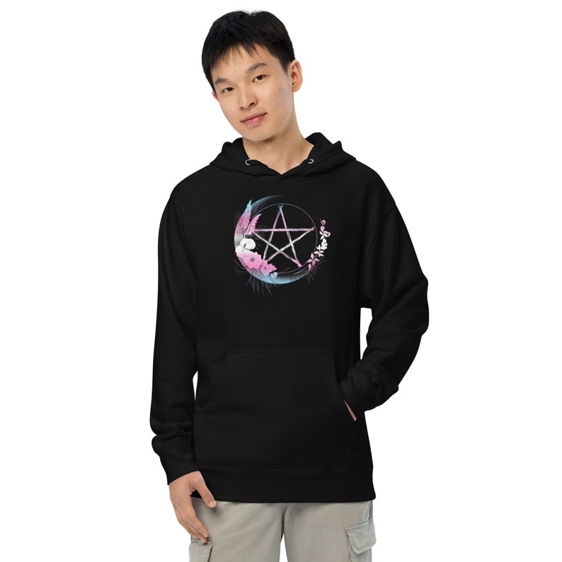 May include: Black hoodie with a pentagram design in pink, blue, and white. The pentagram is surrounded by a crescent moon and floral elements.