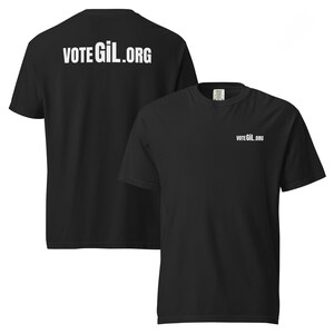 May include: Black t-shirts with white text. One shirt displays "VOTE GiL.ORG" on the front and back. The other shirt shows the same text on the front. Both shirts are short-sleeved and have a crew neck.