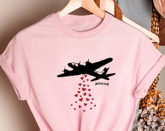 LOVE BOMBING by BANKSY, Love Tee, War Tee, Anti War Tee, Anti War, War Shirt, Love Shirt, Banksy Shirt,Banksy Tee,Banksy,Art Shirt,Art gift,