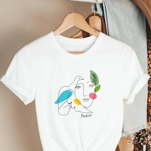 Camiseta minimalista moderna con gráfico de paz y arte lineal de paloma abstracta