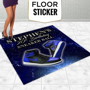 May include: A blue and black floor sticker with the text "Stephen's 20th Birthday Sneaker Ball" and a pair of blue and black sneakers.