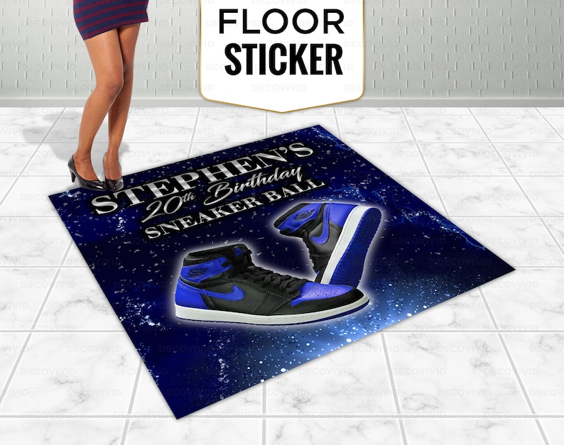 May include: A blue and black floor sticker with the text "Stephen's 20th Birthday Sneaker Ball" and a pair of blue and black sneakers.