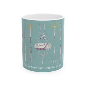 a coffe mug with patterns of surgical instruments on green background
