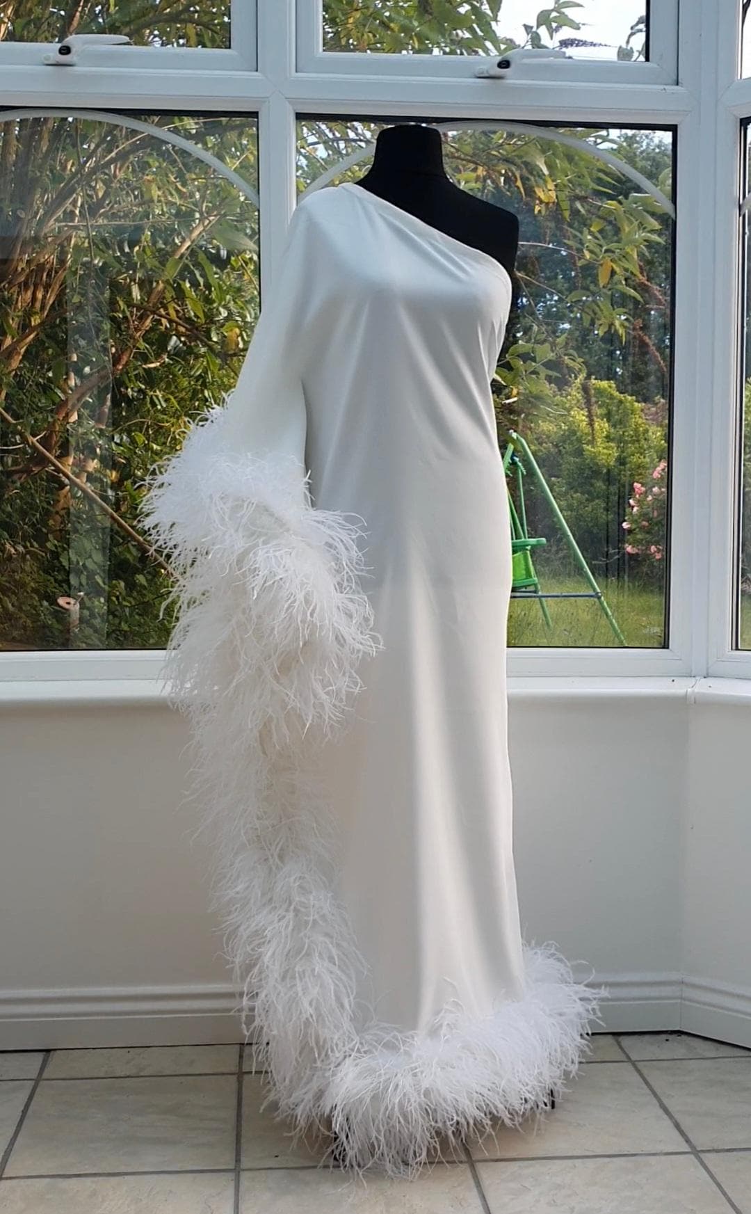 one shoulder feather dress white White One Shoulder Dress with Feather Slit and Flowing Cape Sleeve Walone LLC