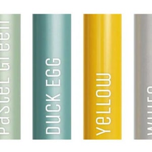 May include: A collection of cylindrical objects in various colors, including clear coat, black, pastel green, duck egg, yellow, white, red, and orange. Each cylinder has a label with its color name in white text.