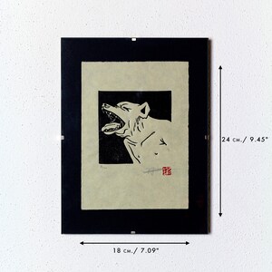 May include: Black and white print of a snarling dog in a black frame. The print is 7.09 inches wide and 9.45 inches tall.