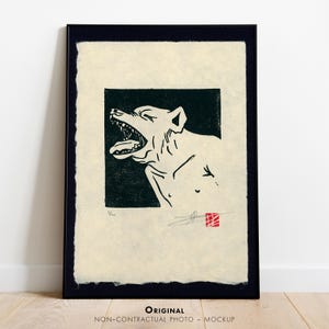 May include: Black and white illustration of a dog with its mouth open, printed on a cream-colored paper with a red stamp in the bottom right corner.