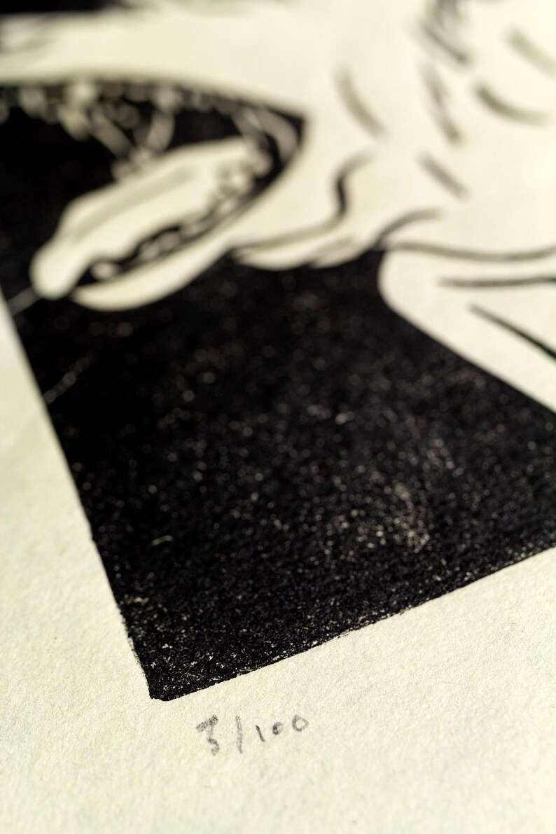 May include: Black and white print of a stylized image. The print is numbered 3/100.