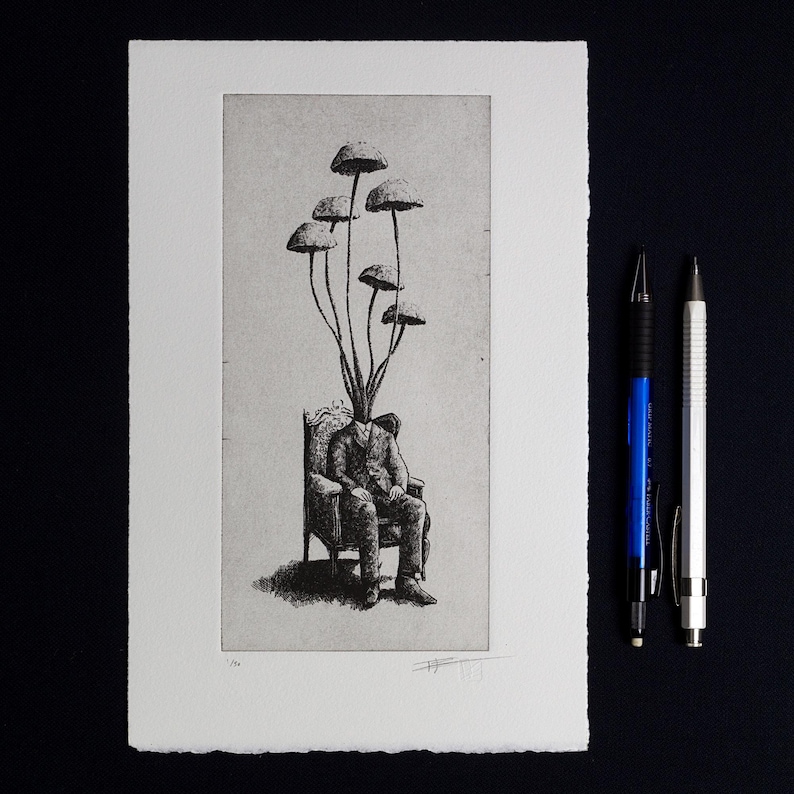 Black and white surrealist etching of a seated man in a suit with mushrooms growing from his head, creating a dreamlike botanical figure. Detailed fine art print with vintage engraving style, combining nature and human form. Contemporary surreal wall art, limited edition print signed by the artist, ideal for collectors of surrealism, mushroom art, dark academia decor, and unique modern gallery wall pieces.