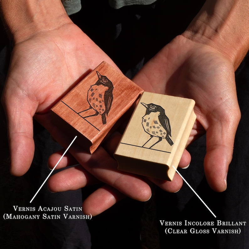 A rubber stamp with an illustration of a bird and the text EX LIBRIS CLEMENT SCARPI rests beside its stamped impression on a book page, making a parfait cadeau fait main for collectors of bijoux uniques or vintage treasures.