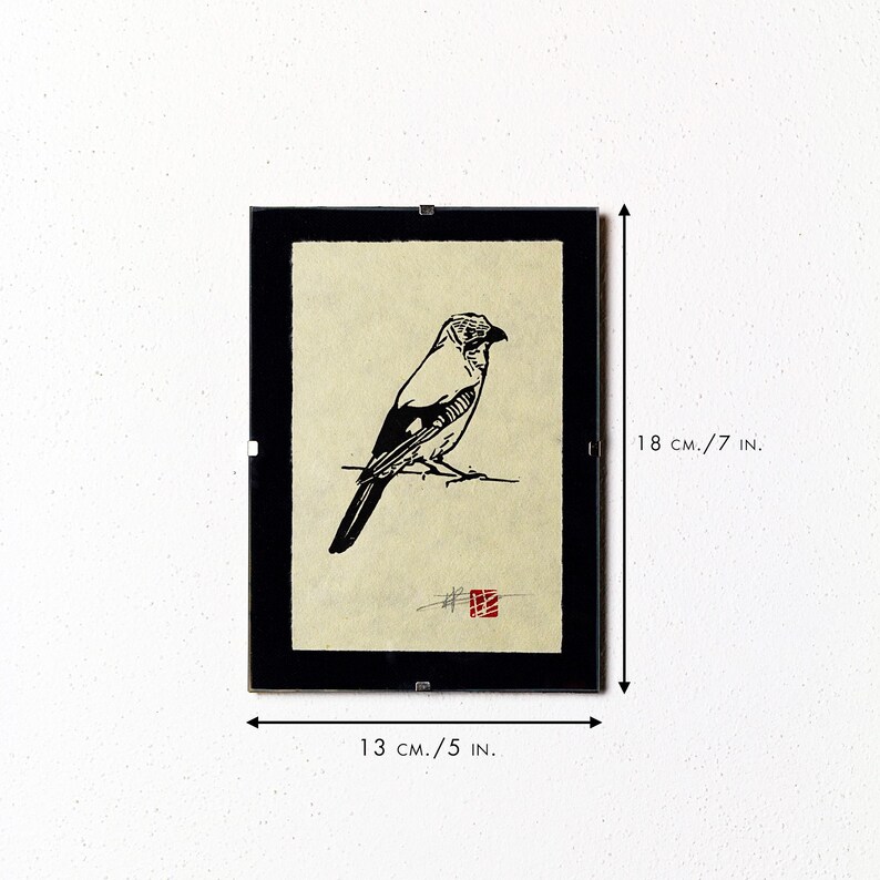 May include: Framed black and white bird art print. The artwork features a detailed illustration of a bird perched on a branch. The frame measures 18 cm high and 13 cm wide.