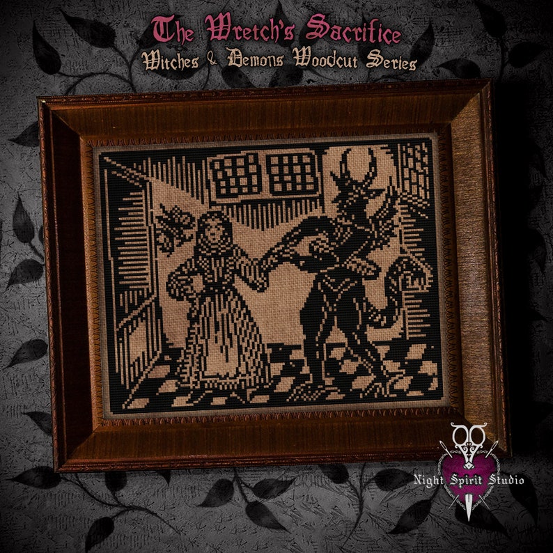 May include: A framed black and white cross-stitch design depicting a woman in a long dress and a horned demon. The title "The Wretch's Sacrifice" and "Witches & Demons Woodcut Series" are above the image. The image is framed in a dark brown wood frame.