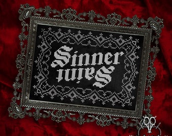 May include: A black and white cross-stitch design in a silver frame. The design features the words "Sinner" and "Juices" in a gothic font.