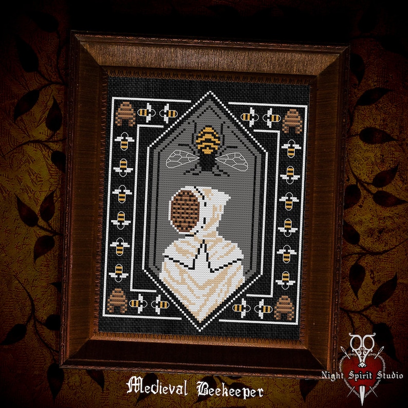 May include: A cross-stitch pattern of a medieval beekeeper wearing a white hooded suit with a beehive-shaped mask. The beekeeper is surrounded by bees and beehives. The pattern is framed in a dark wood frame. The text "Medieval Beekeeper" is printed below the frame.