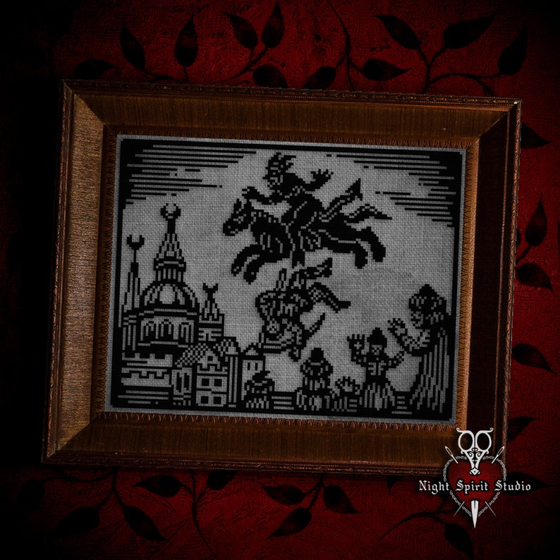May include: A black and white cross-stitch embroidery framed in a dark wood frame. The embroidery depicts a witch riding a broomstick over a city skyline. The text "Night Spirit Studio" is visible in the bottom right corner.