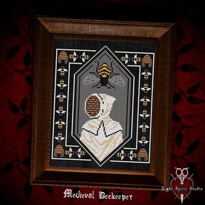 May include: A cross-stitch pattern of a medieval beekeeper wearing a white hooded suit with a beehive-shaped mask. The beekeeper is surrounded by a border of bees and beehives. The pattern is framed in a dark wood frame.