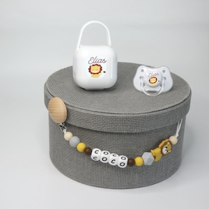 Silicone pacifier and pacifier with lion motif. From birth