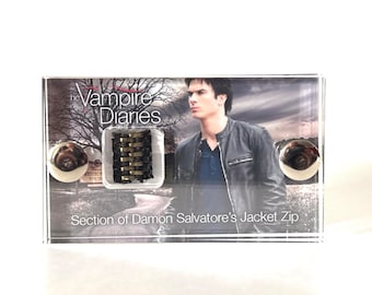 The Vampire Diaries - Section of Damon Salvatore’s Jacket Zip mini display.