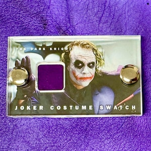 Batman - The Dark Knight - Section of Production Used Joker Costume Fabric mini display.