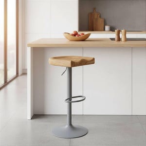 Minimalist handcrafted oak bar stool with adjustable height in modern white kitchen, made in Germany