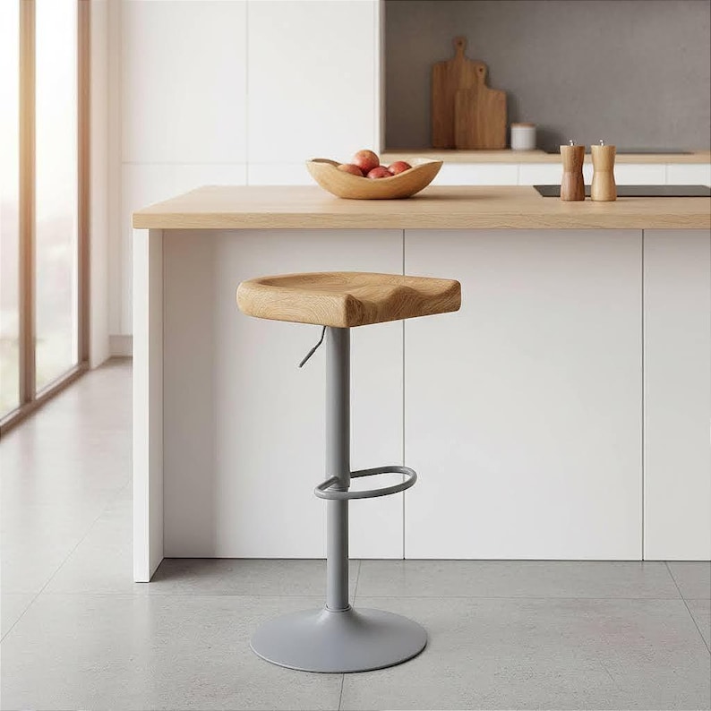 Minimalist handcrafted oak bar stool with adjustable height in modern white kitchen, made in Germany