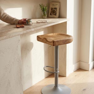 Handcrafted solid oak bar stool with swivel base in modern kitchen, made in Germany