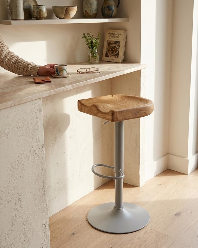 Handcrafted solid oak bar stool with swivel base in modern kitchen, made in Germany