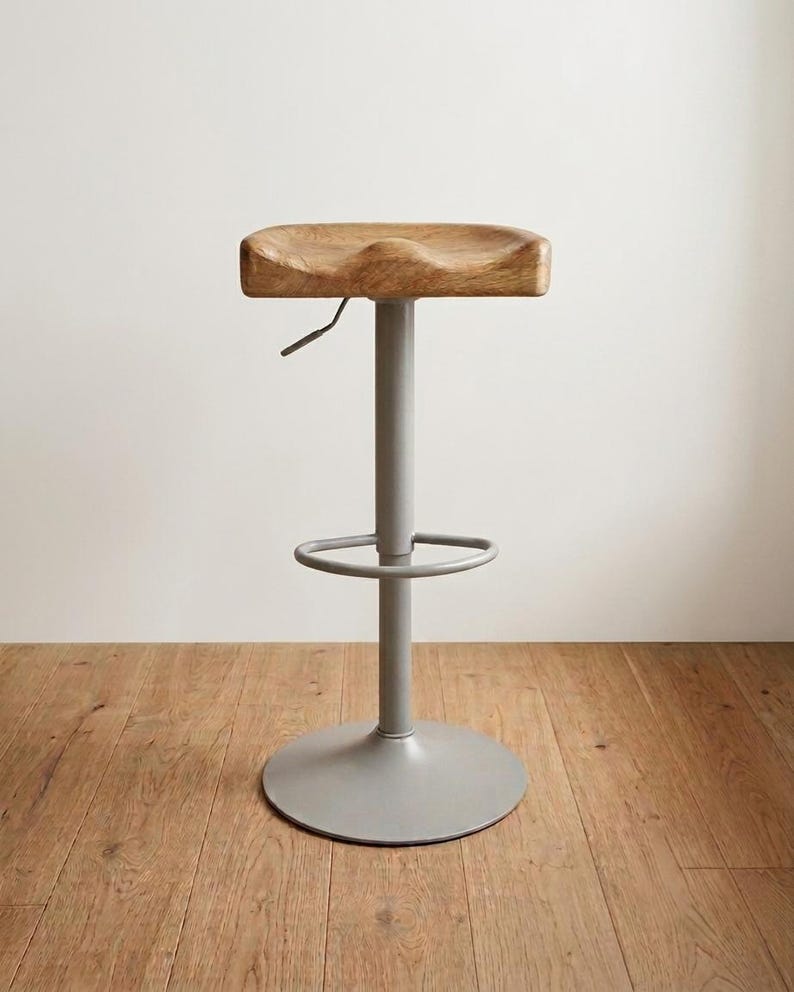 Side view of solid oak bar stool with metal base, height adjustable, handcrafted in Germany